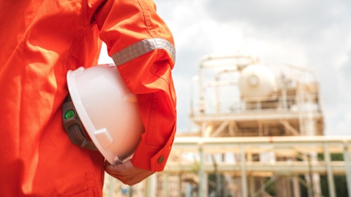 worker in orange PPE at a plant-1