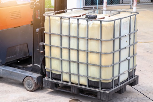chemical IBC being transported with forklift