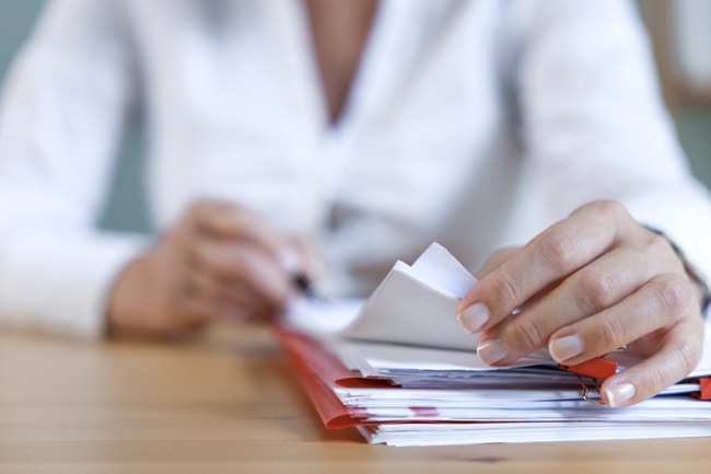 staff with paperwork at a desk