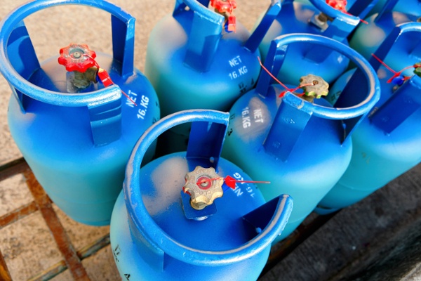 blue propane bottles on outdoor rack-1