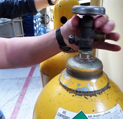 Gas cylinders being inspected