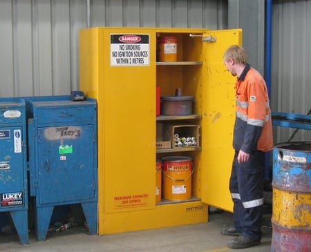 flammable cabinet and staff member