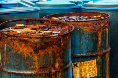 metal barrels corroded by chemical leakage