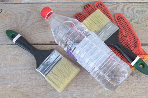 acetone bottle with paint brushes