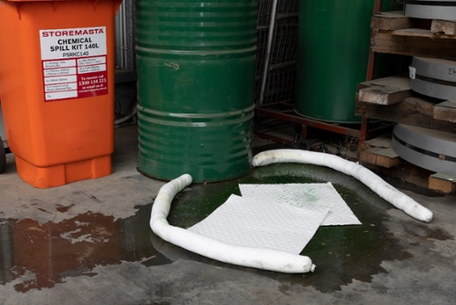 chemical spill kit in use with absorbents on floor-1-1