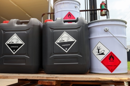 corrosive containers and drums on a pallet