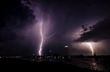 lightning striking over a city