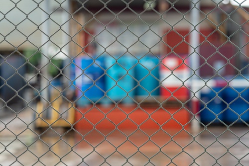 outdoor chemical storage area with fence