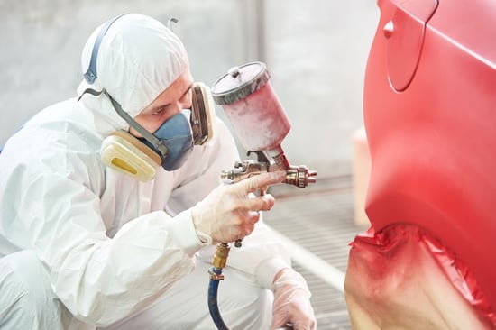 staff spray painting car