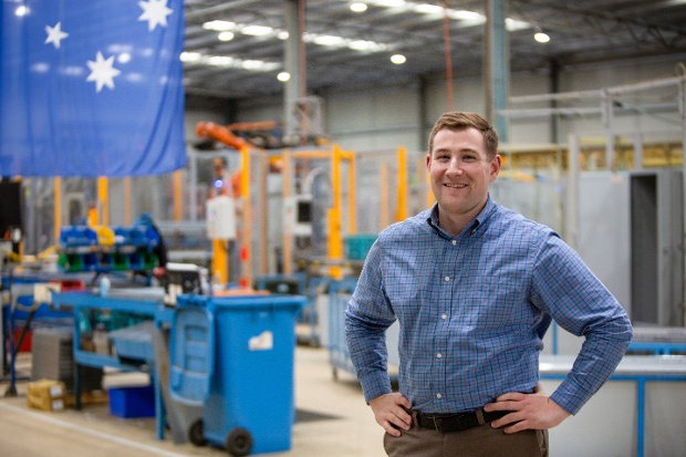 Caleb Urquhart in Manufacturing Facility with Aus flag-1