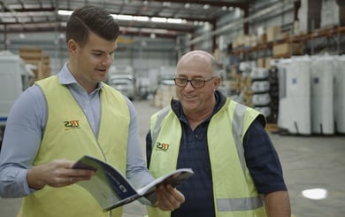 two staff performing a dangerous goods risk assessment