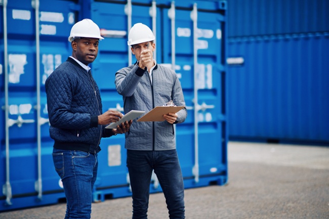 Two staff members looking at an outdoor job  site